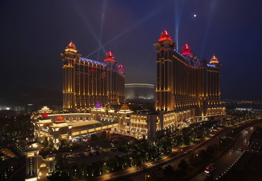 Galaxy Macau, the latest resort in Macau built by Galaxy Entertainment Group, is lit up in the evening after it opened for business May 15, 2011. Some of the world's biggest casino operators are betting that Chinese moms and pops who like to gamble and also want to shop and dine will turbocharge growth over the next few years at Macau, the world's biggest gambling destination. Macau, located on the Southern tip of China and an hour away by ferry from Hong Kong, has so far relied heavily on China's young and wealthy for casino revenues, which totaled about $24 billion in 2010 -- well above what Las Vegas earned.    REUTERS/Bobby Yip   (CHINA - Tags: BUSINESS TRAVEL ENTERTAINMENT) - RTR2MFZ3